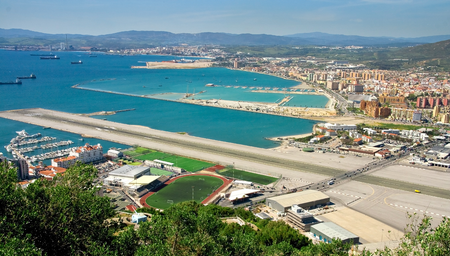 Gibraltar_Airport_main_runway_with_4-lane_road_crossing.jpg