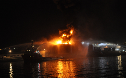 Oil_Sullage_Tank_continues_burning_through_the_night.jpg